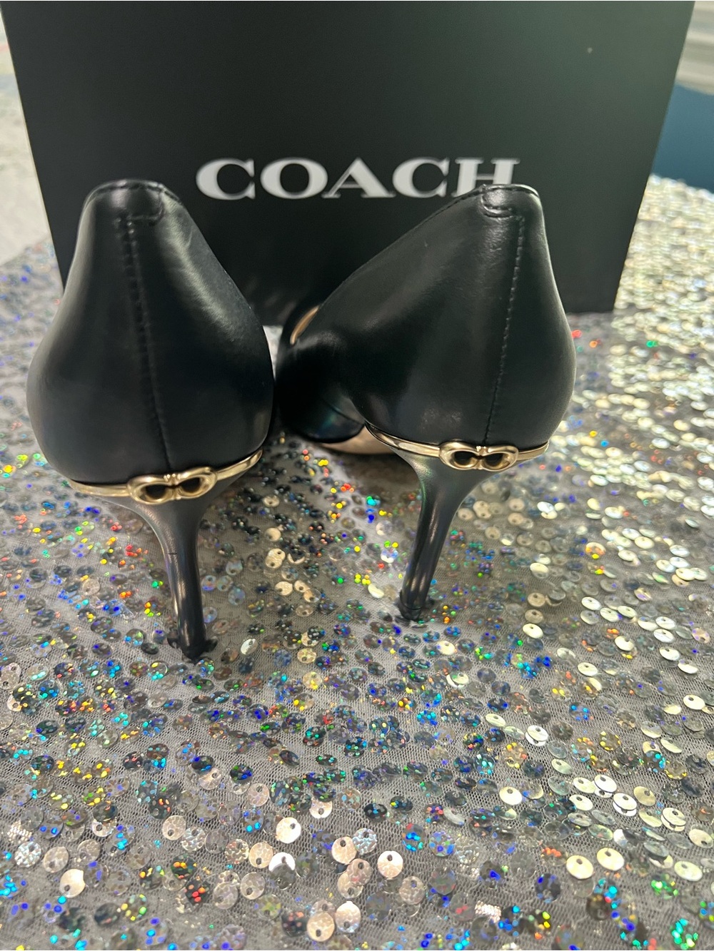 Coach Black Leather Stiletto Pump with Gold Heel Accent